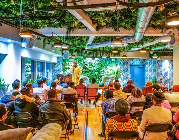 Around forty Black queer men gathered together, December 2019